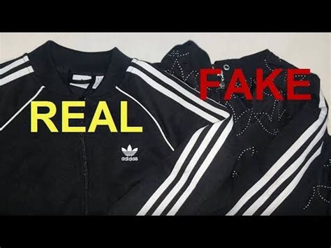 fake adidas jacket with|genuine adidas zip up jacket.